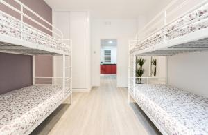 A bed or beds in a room at Chamberi Arrendamiento de Temporada