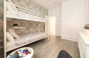 A bed or beds in a room at Chamberi Arrendamiento de Temporada