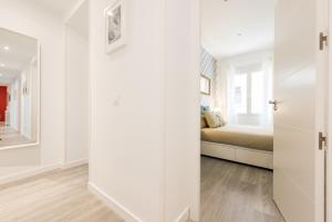A bed or beds in a room at Chamberi Arrendamiento de Temporada