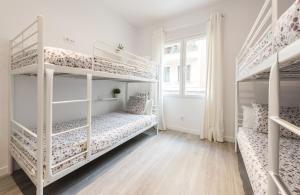 A bed or beds in a room at Chamberi Arrendamiento de Temporada