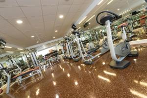 a gym with several rows of tread machines at Das Eisenberg in Sankt Martin an der Raab