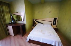 A bed or beds in a room at Black Sea Star Batumi