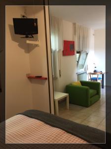 TV a/nebo společenská místnost v ubytování Hotel Moderno