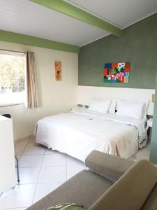 Ένα ή περισσότερα κρεβάτια σε δωμάτιο στο Pousada Requinte da Mantiqueira