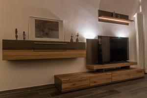 a flat screen tv sitting on a wall at Apartment Haltern in Haltern