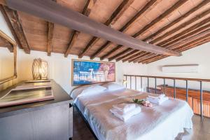 A bed or beds in a room at Loggia panoramica