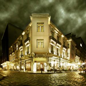 a large building on a street at night at Capsis Bristol Boutique Hotel in Thessaloniki