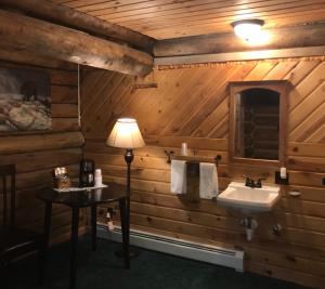 a bathroom with a sink and a toilet at Judith Mountain Lodge in Lewistown