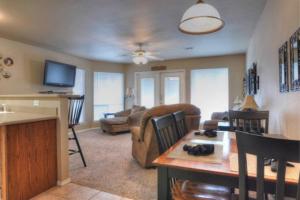 a living room with a couch and a table at Windrow Retreat in New Braunfels