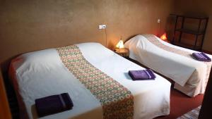 En eller flere senge i et værelse på Kasbah du Bout du Monde