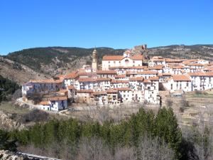 a small town on a hill with white buildings at La Antigua Posada in Linares de Mora
