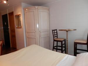 Postel nebo postele na pokoji v ubytování Hotel du Gambrinus