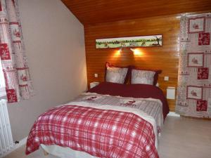 Cama ou camas em um quarto em La Petite Bresse