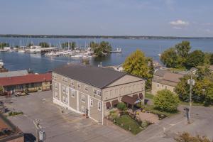an aerial view of a building next to a marina at Harbor House Inn in Sackets Harbor