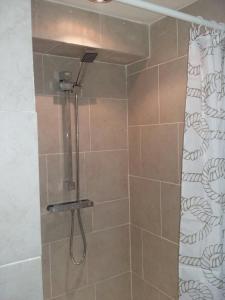 a shower with a glass door in a bathroom at The Boe Rigg in Hexham