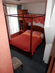 Postel nebo postele na pokoji v ubytování Hotel du Gambrinus