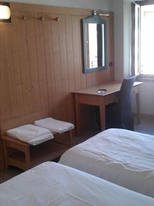 Postel nebo postele na pokoji v ubytování Residence Centrale