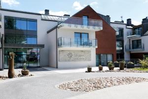 a building with a sign on the side of it at Hotel Skipper in Rewa