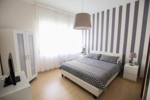 Posteľ alebo postele v izbe v ubytovaní Bernini 20