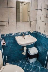 a bathroom with a sink and a toilet at Family Hotel Amore in Byala +67 photos