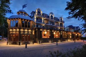 a large building with lights on it at night at Europa Hotel Kühlungsborn in Kühlungsborn