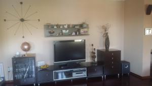 a living room with a flat screen tv on a wall at Villa Marija in Marina