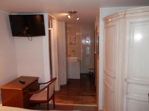 TV a/nebo společenská místnost v ubytování Hotel du Gambrinus