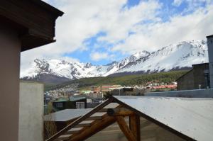 a view of a snow covered mountain from a balcony at Torre al Sur in Ushuaia