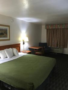 A bed or beds in a room at Extend-a-Suites Phoenix