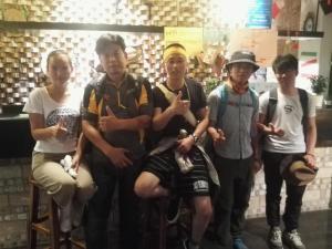 a group of people posing for a picture at Huashan Lotus International Hostel in Huayin