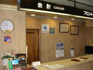 a clock is on the wall of a waiting room at Kawasaki River Hotel in Kawasaki