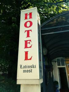 
The logo or sign for the hotel
