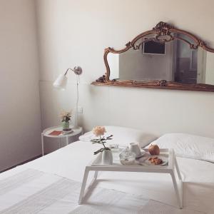 A bed or beds in a room at Villa Pacchioni