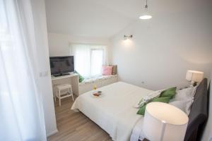 Posteľ alebo postele v izbe v ubytovaní Villa Elysium - beautiful family house with heated pool