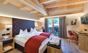 Postel nebo postele na pokoji v ubytování Wellness Hotel Gran Risa***S