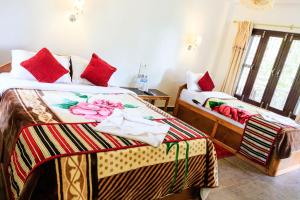 Letto o letti in una camera di Tiger Residency Resort