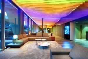 a living room with couches and tables in a building at Hotel SB Glow Sup in Barcelona