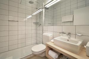 Koupelna v ubytování Hotel des Alpes + 31 fotografií