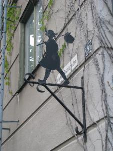 a statue of a woman on the side of a building at Örnsköldsviks Vandrarhem in Örnsköldsvik