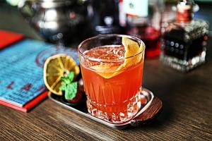 a drink in a glass sitting on a table at Casati Hotel - Adults Only in Budapest