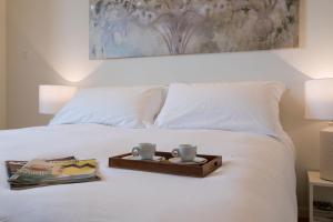 Postel nebo postele na pokoji v ubytování La Ripa Boutique Hotel
