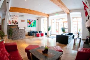 a living room with couches and a fireplace at Vila Sara/Adult Only in Sovata