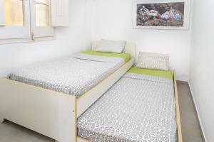 A bed or beds in a room at Private Roof Top Sant Antoni