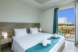 A bed or beds in a room at Sisi Breeze Hotel