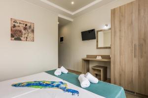 A bed or beds in a room at Sisi Breeze Hotel