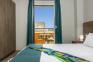 A bed or beds in a room at Sisi Breeze Hotel