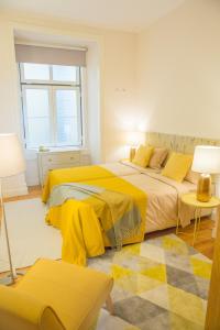Postel nebo postele na pokoji v ubytování Rent4Rest - Lisbon Downtown Designer's Apartment