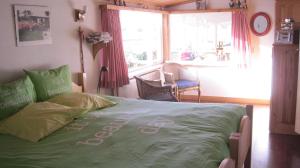 En eller flere senger på et rom på Inge's Cottage