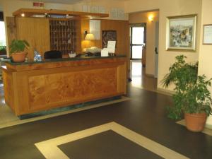 a lobby with a reception desk in a building at Campus Hotel in Bari