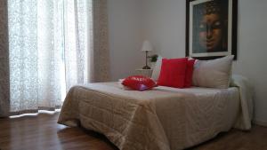 A bed or beds in a room at Casa de Huéspedes Prada
